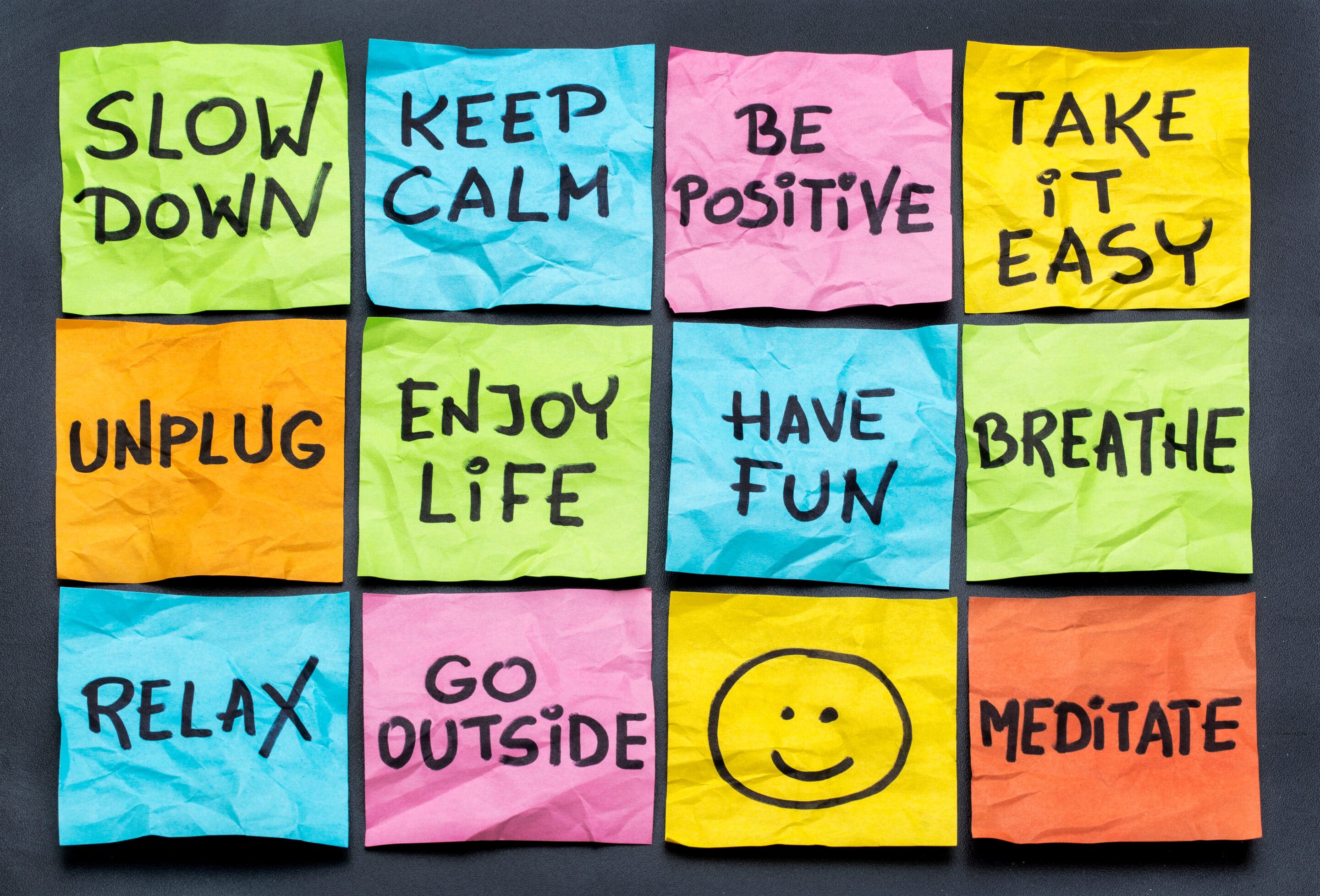 lifestyle reminders on colorful sticky notes including slow down, relax, take it easy, keep calm and other motivational reminders